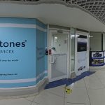 stepping stones-A prominent light blue wall sign for a business named "Stepping Stones" with the tagline "TRADEMARK SERVICES". Below the name, there are bullet points listing services such as "Trademark Registration," "Copyright Registration," and "Visa Services."